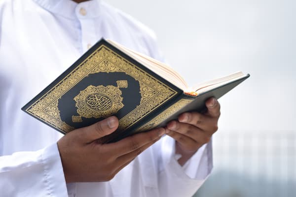 man reading quran